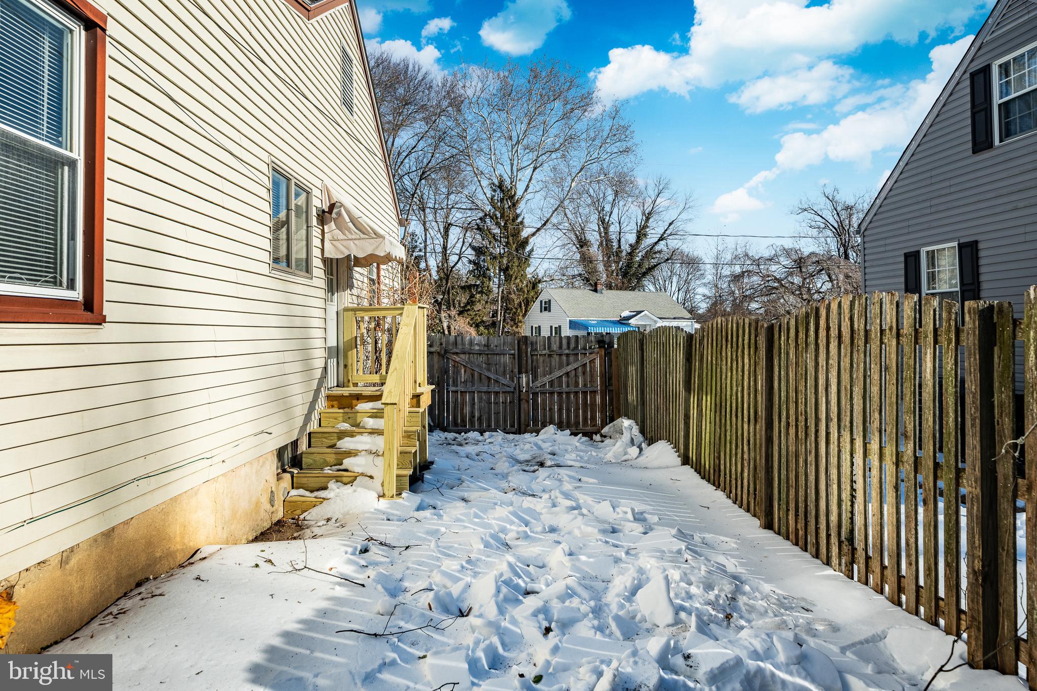 8 Garrett Road Wilmington, DE 19809 - Photo 27 of 37 a view of a backyard with wooden fence