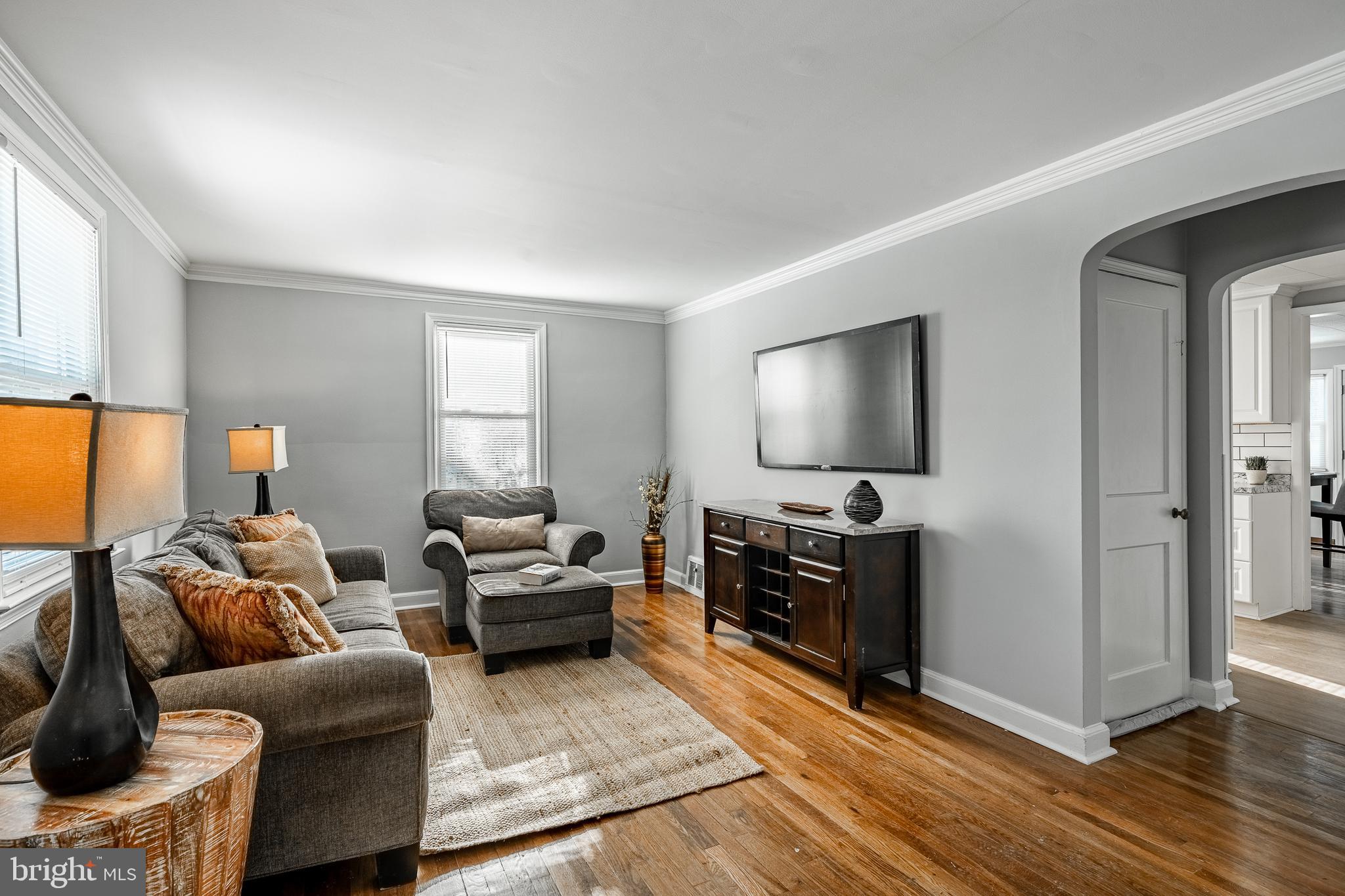 8 Garrett Road Wilmington, DE 19809 - Photo 4 of 37 a living room with furniture and a flat screen tv