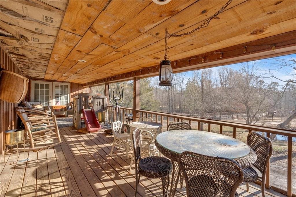 2623 Big Texas Valley Road Northwest Rome, GA 30165 - Photo 47 of 90 a view of a balcony dining area with furniture