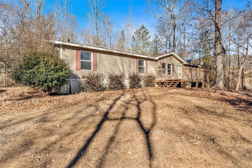 2623 Big Texas Valley Road Northwest Rome, GA 30165 - Photo 56 of 90 a view of a house with a yard covered in snow