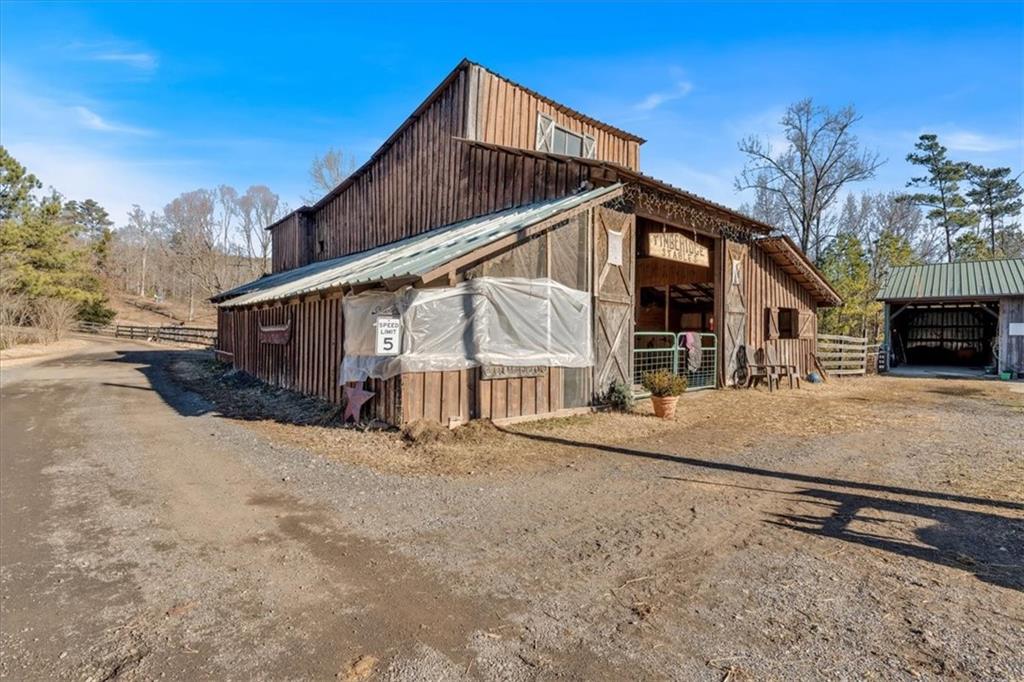 2623 Big Texas Valley Road Northwest Rome, GA 30165 - Photo 63 of 90 a view of a house with a wooden fence
