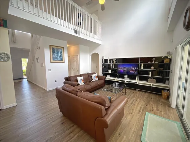 a spacious bedroom with a bed and a window