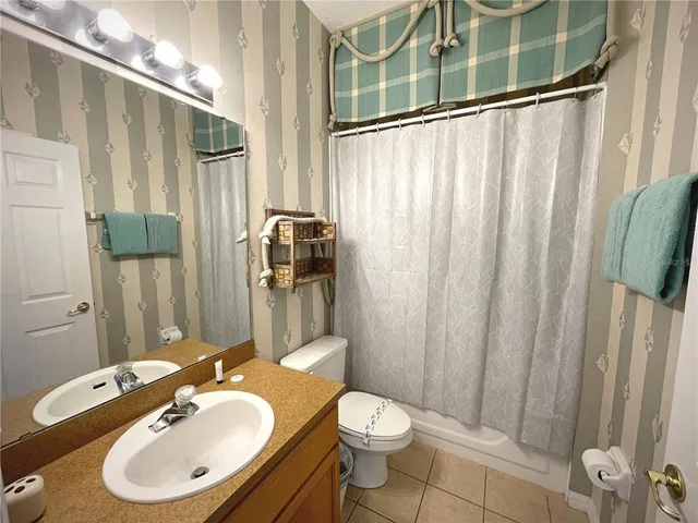 a bedroom with bed and window