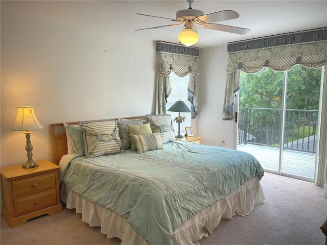 a balcony with wooden floor and fence
