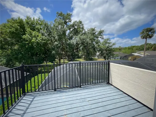 a balcony with wooden floor
