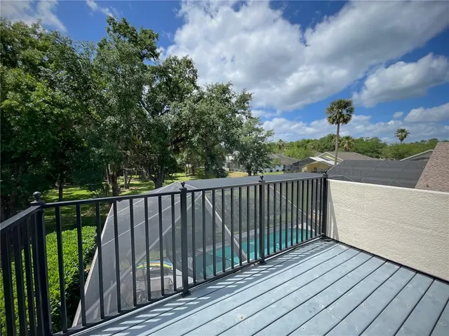 a view of a balcony with wooden fence