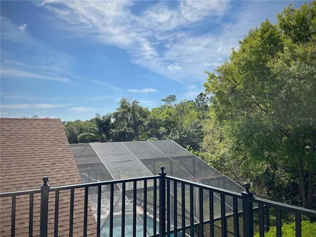 a bathroom with a tub a sink and mirror