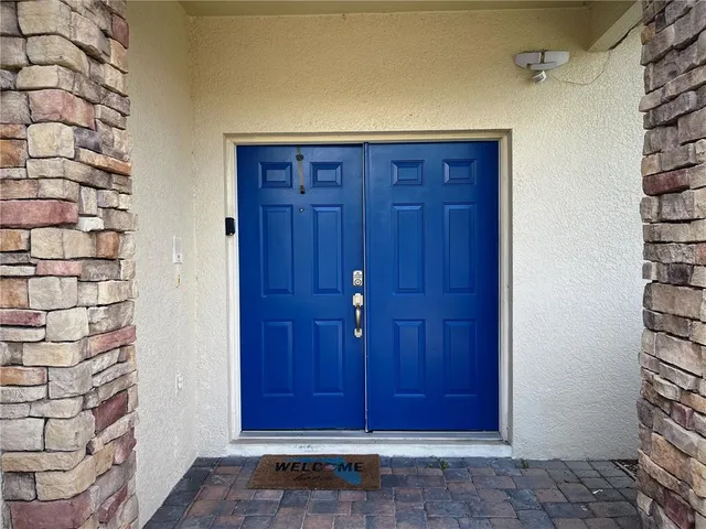 a view of a dining room with furniture wooden floor and a chandelier