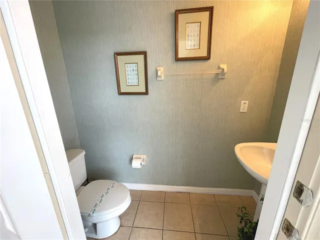 a view of a room with furniture and wooden floor