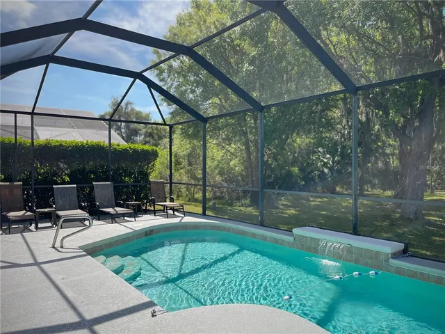 a view of a field with an trees