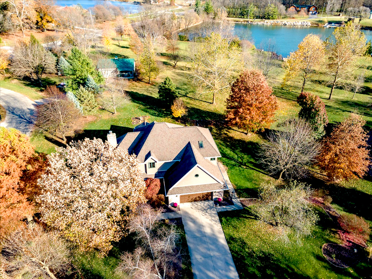 an aerial view of houses with outdoor space