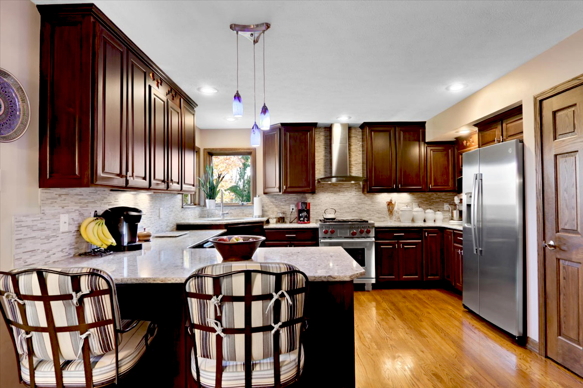 20379 Cedar Avenue Downs, IL 61736 - Photo 44 of 97 a kitchen with stainless steel appliances granite countertop a stove refrigerator a sink dishwasher a dining table and chairs with wooden floor