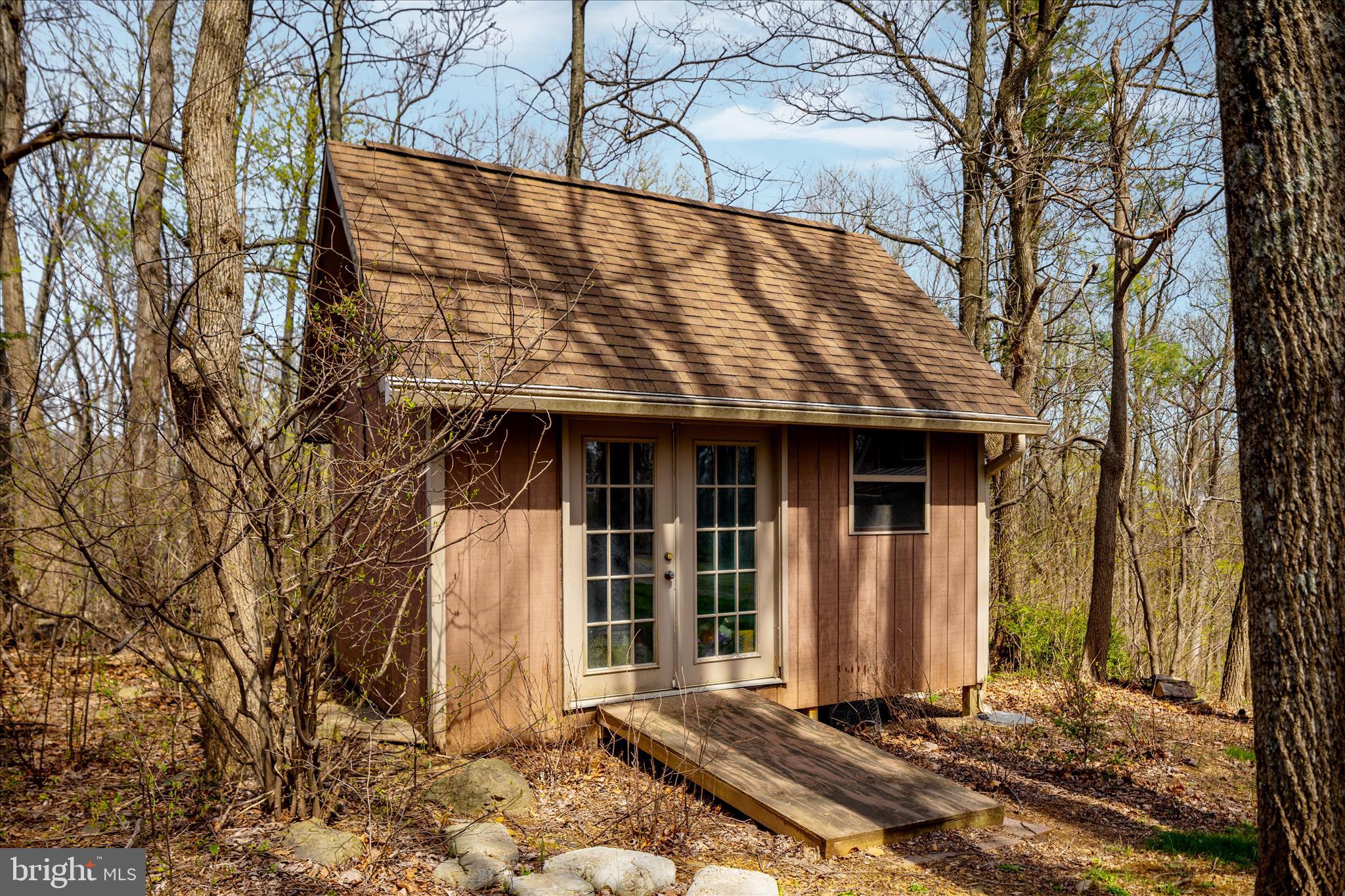 17352 Raven Rocks Road Round Hill, VA 20141 - Photo 16 of 47 a front view of a house with a garden