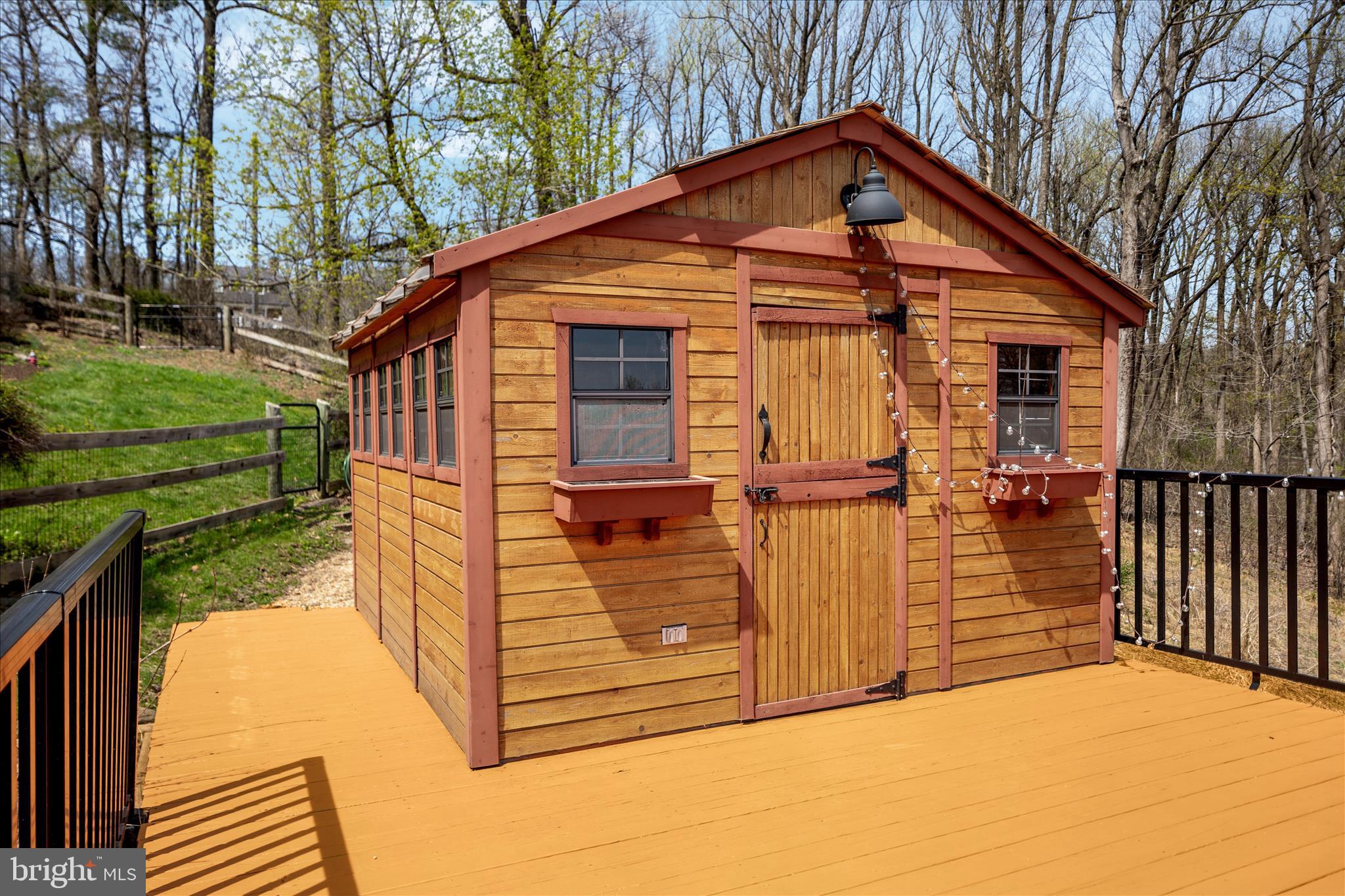 17352 Raven Rocks Road Round Hill, VA 20141 - Photo 20 of 47 a view of a small house with wooden fence