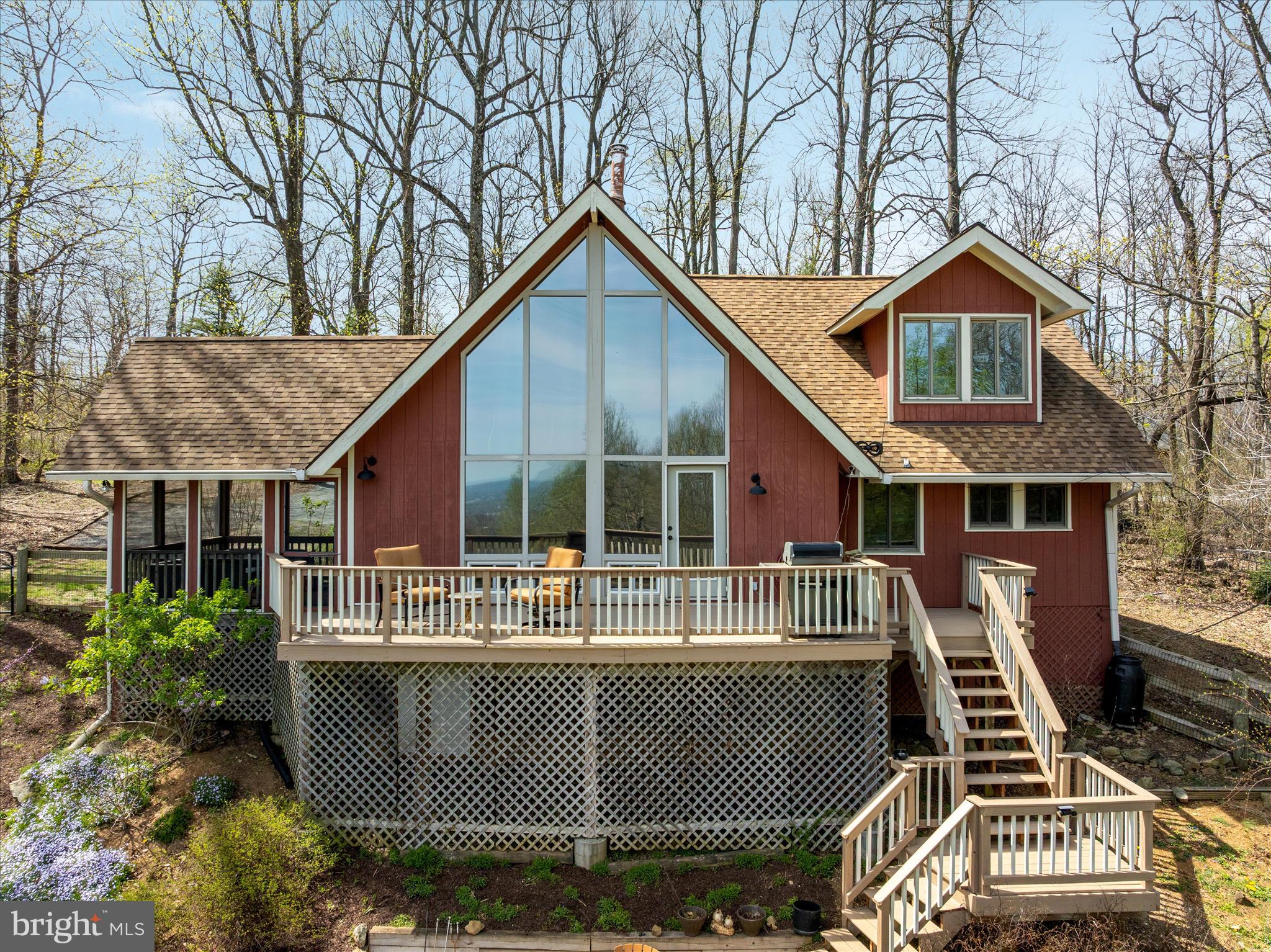 17352 Raven Rocks Road Round Hill, VA 20141 - Photo 38 of 47 a front view of house with large trees and wooden fence