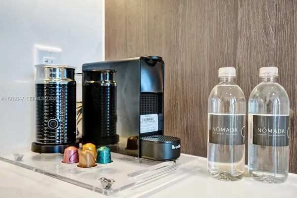 a front view of a house with outdoor seating