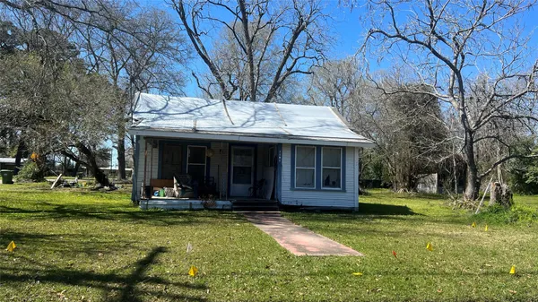 a view of a house with a yard porch and sitting area