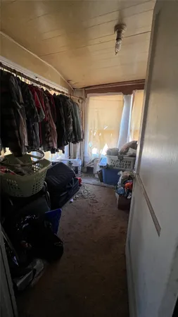 a bed room with a bed and a window