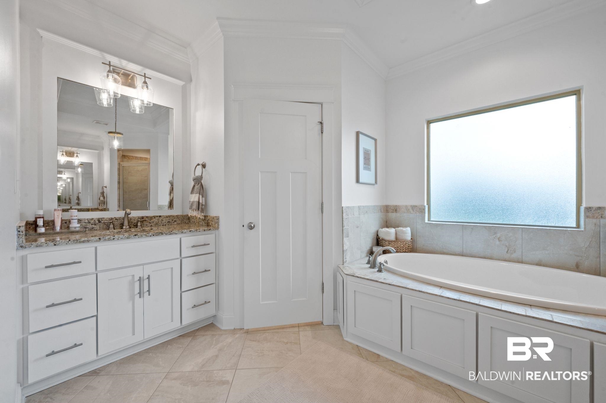 418 Fortune Drive Fairhope, AL 36532 - Photo 27 of 63 Bathroom with vanity, crown molding, a bathing tub, and tile patterned floors