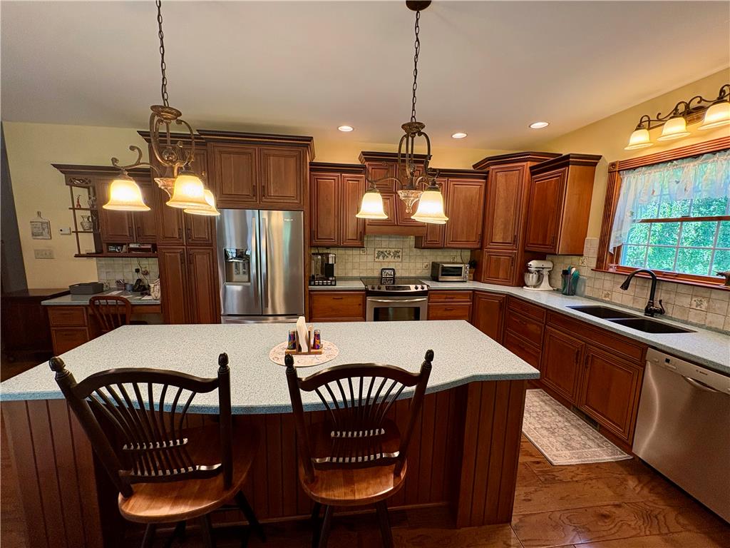 1222 Spring Road Andreas, PA 18211 - Photo 10 of 38 A well-appointed kitchen offers ample counter space and rich wooden cabinetry, perfect for culinary endeavors.