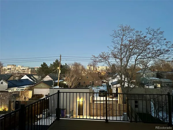 a view of a balcony with city view
