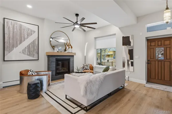 a living room with furniture and a fireplace