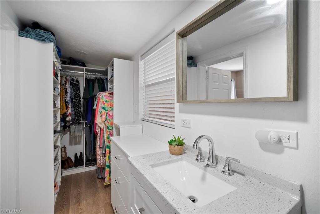 19034 Flamingo Road Fort Myers, FL 33967 - Photo 20 of 31 a bathroom with a sink and a mirror
