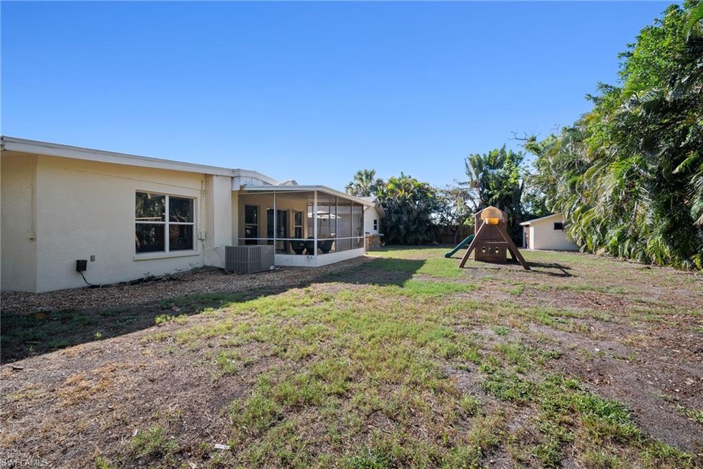 19034 Flamingo Road Fort Myers, FL 33967 - Photo 30 of 31 a view of a house with backyard and a tree