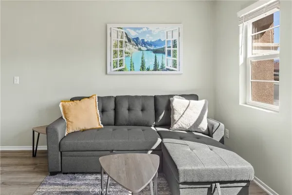 a living room with furniture and a window