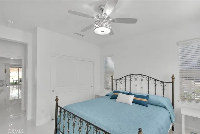 a bedroom with furniture and a window