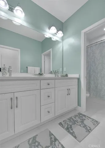 a bathroom with a sink a vanity and a mirror