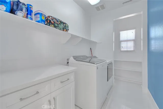 a view of swimming pool with a yard and plants