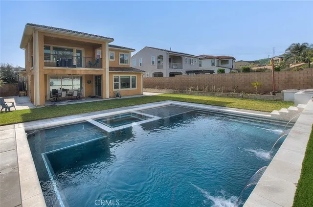 a view of a dining room with furniture wooden floor and a chandelier