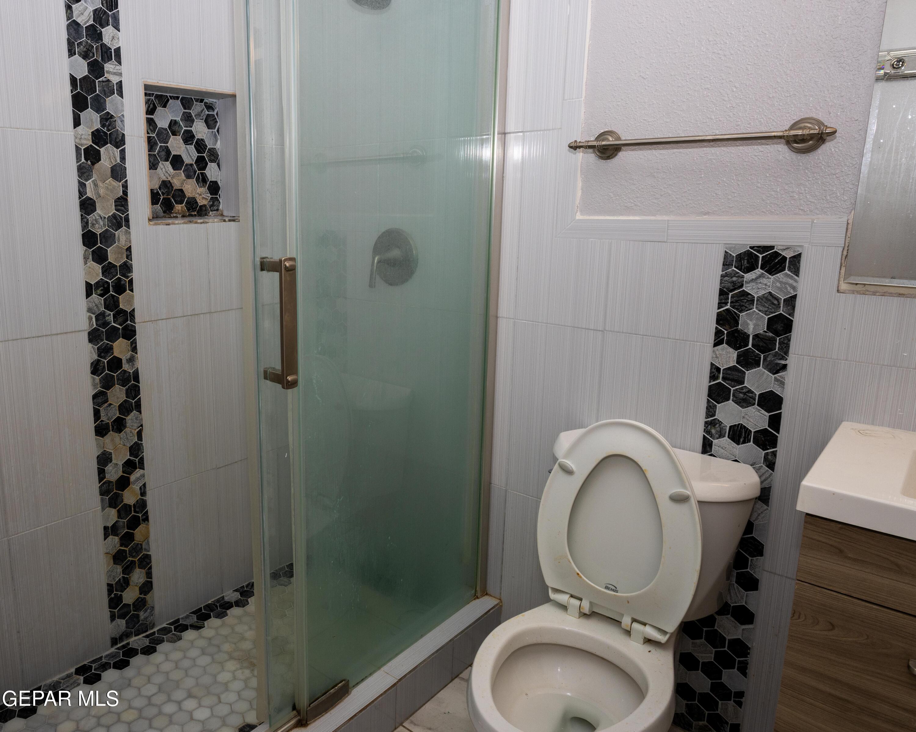 7860 Porche Street El Paso, TX 79915 - Photo 5 of 10 a bathroom with a toilet and a shower