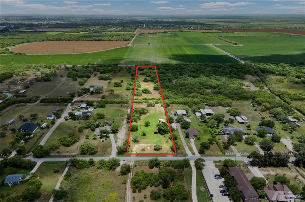 33863 California Road Los Fresnos, TX 78566 - Photo 7 of 7 an aerial view of a residential houses with outdoor space and trees
