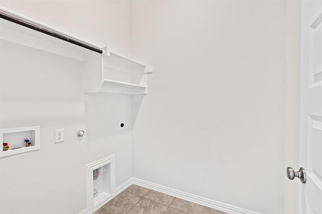 4149 Beale Street Heartland, TX 75114 - Photo 11 of 27 a view of utility room with empty racks