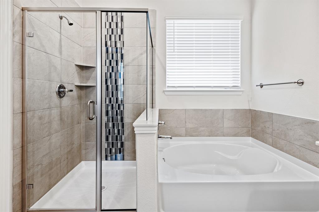 4149 Beale Street Heartland, TX 75114 - Photo 15 of 27 a bathroom with a bathtub and a shower