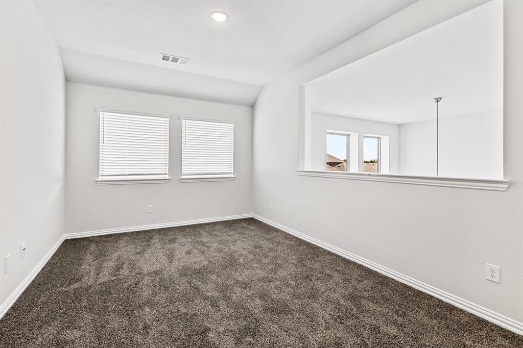 4149 Beale Street Heartland, TX 75114 - Photo 17 of 27 an empty room with a window