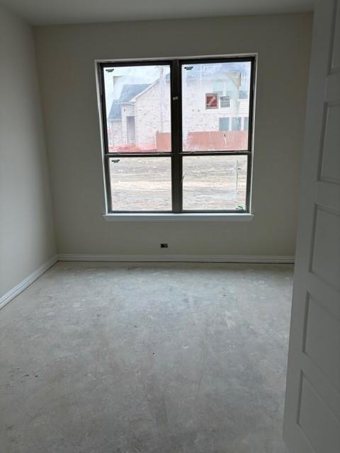 4149 Beale Street Heartland, TX 75114 - Photo 21 of 27 an empty room with a window