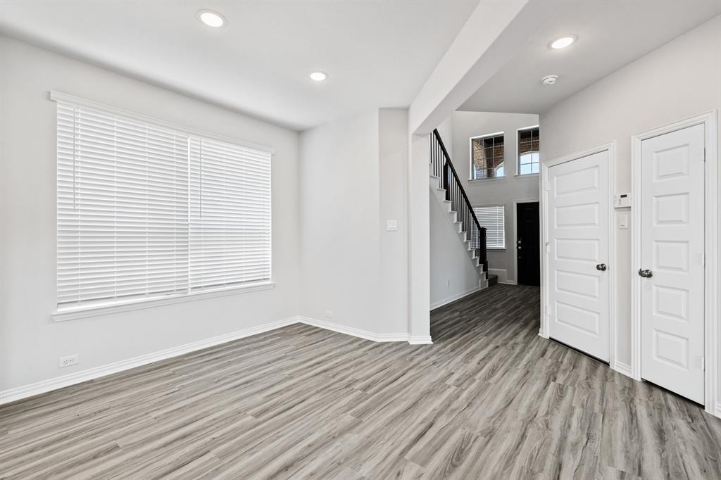 4149 Beale Street Heartland, TX 75114 - Photo 8 of 27 wooden floor in an empty room with a window