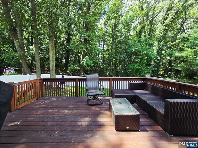 a view of a wooden deck with a bench