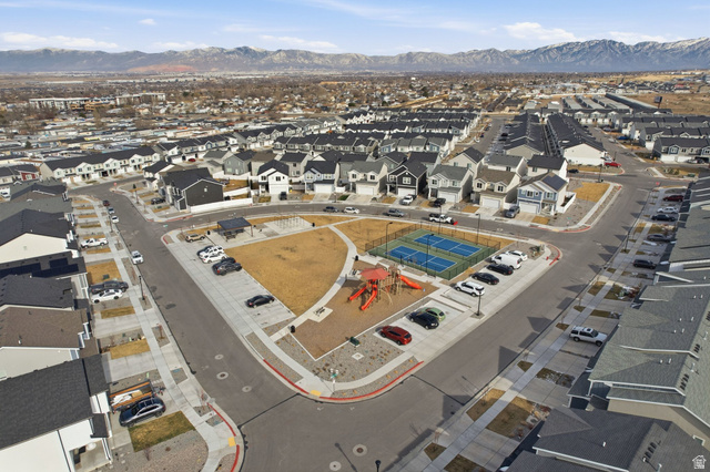 3808 Galatia Road Magna, UT 84044 - Photo 48 of 59 Community green space featuring a playground, two tennis courts, and a covered picnic area
