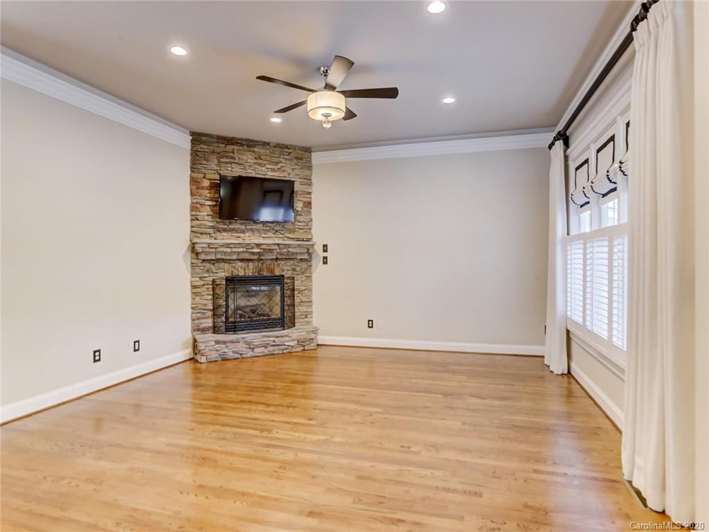 317 Third Baxter Street Fort Mill, SC 29708 - Photo 11 of 48 a view of an empty room with wooden floor and a window