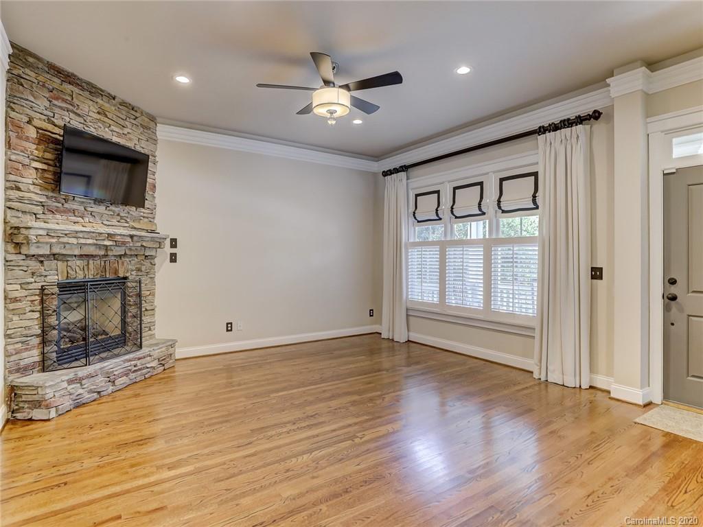 317 Third Baxter Street Fort Mill, SC 29708 - Photo 12 of 48 a view of an empty room with a fireplace and a window
