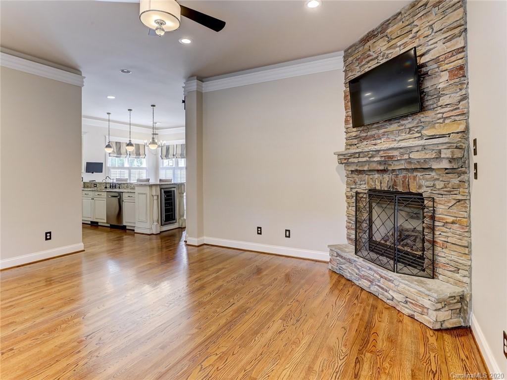 317 Third Baxter Street Fort Mill, SC 29708 - Photo 13 of 48 a view of a livingroom with wooden floor and a fireplace
