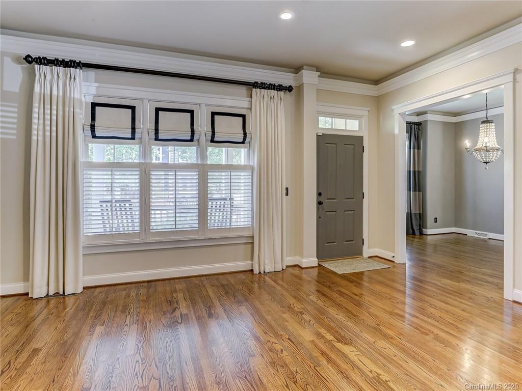 317 Third Baxter Street Fort Mill, SC 29708 - Photo 14 of 48 a view of empty room with wooden floor and fan