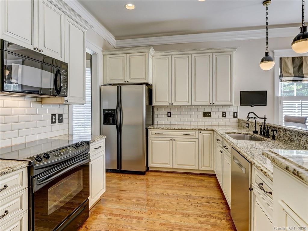 317 Third Baxter Street Fort Mill, SC 29708 - Photo 15 of 48 a kitchen with a sink stove and refrigerator