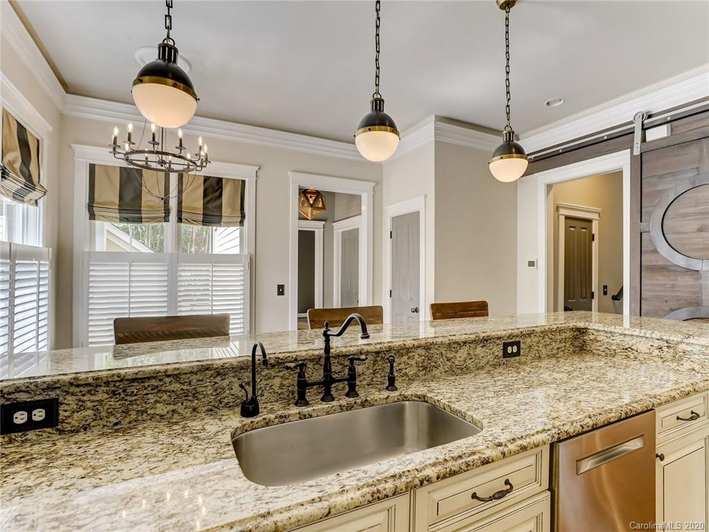 317 Third Baxter Street Fort Mill, SC 29708 - Photo 19 of 48 a bathroom with a granite countertop sink a mirror and a shower