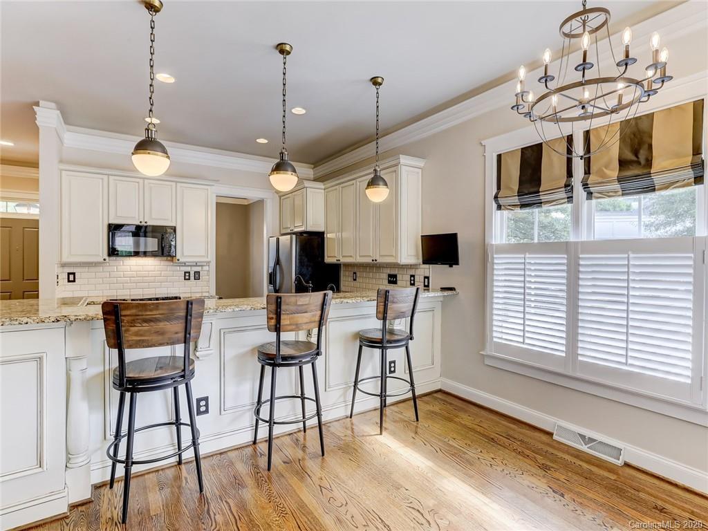 317 Third Baxter Street Fort Mill, SC 29708 - Photo 20 of 48 a view of a dining room with furniture window and wooden floor