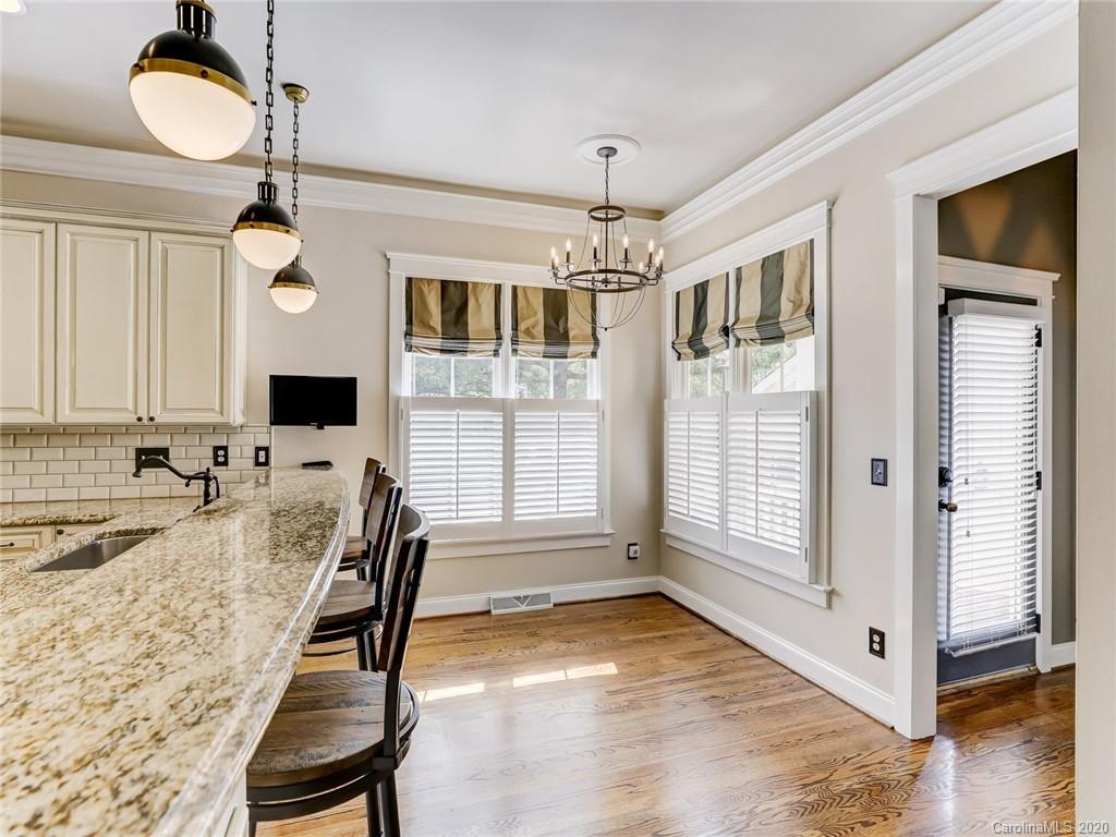 317 Third Baxter Street Fort Mill, SC 29708 - Photo 21 of 48 a dining room with wooden floor and furniture